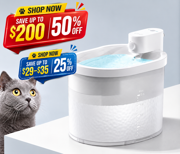 A white automatic pet water fountain with water flowing from the top, shown on a white platform against a light gray background. A gray cat is partially visible on the left, and two colorful 'SHOP NOW' sale banners appear on the left side of the image.