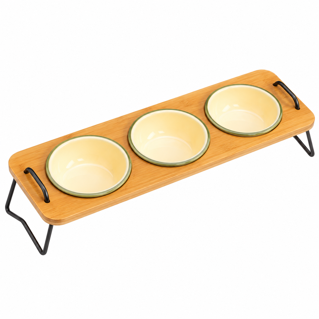 A three-bowl pet feeder made of light natural wood with black metal legs and handles, holding three pale yellow bowls with green rims, shown on a white background.