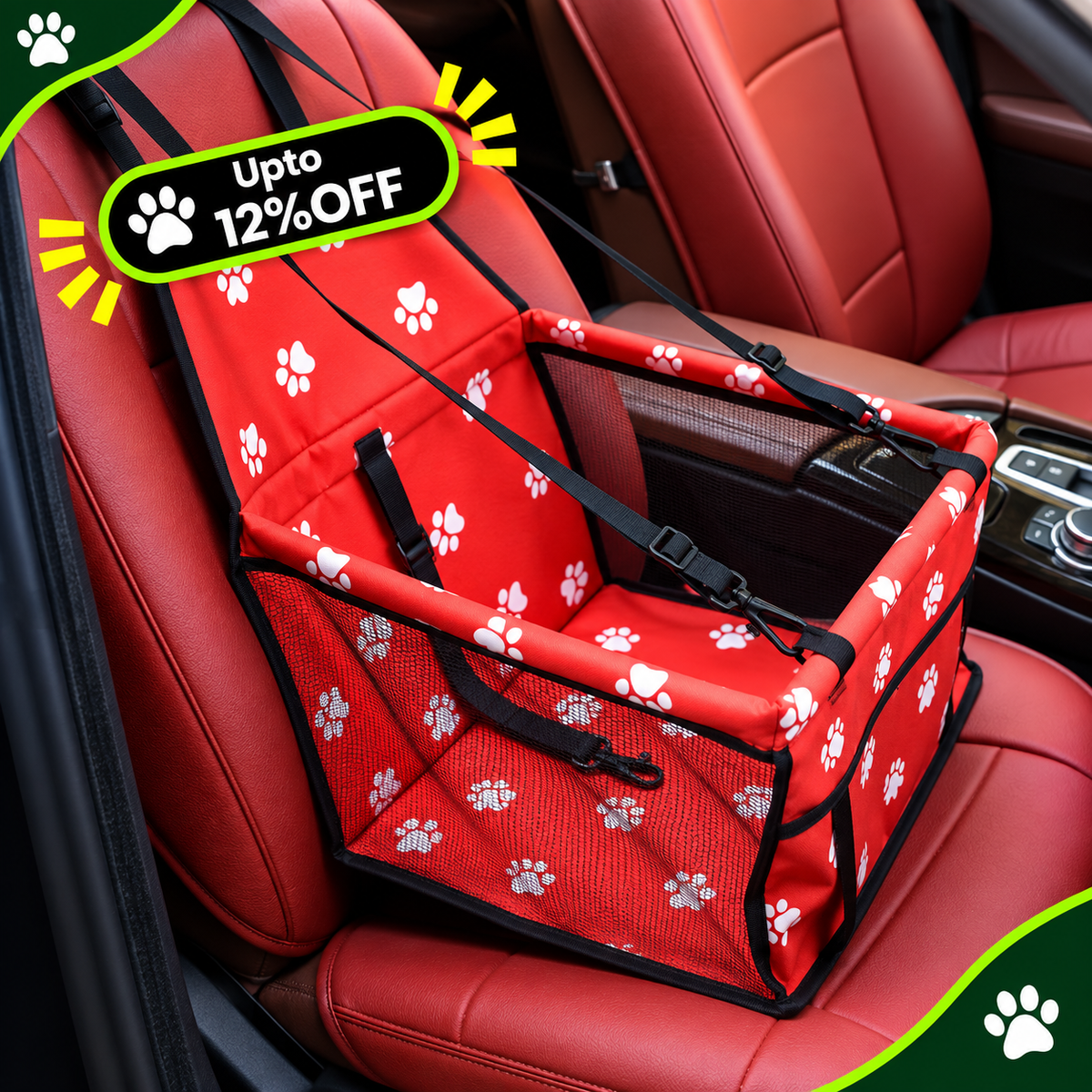 A red pet booster seat with white paw print patterns, installed on a car's front seat. The booster seat has black straps and mesh sides, with a green and yellow 'Upto 12% OFF' promotional badge overlay in the top left corner.